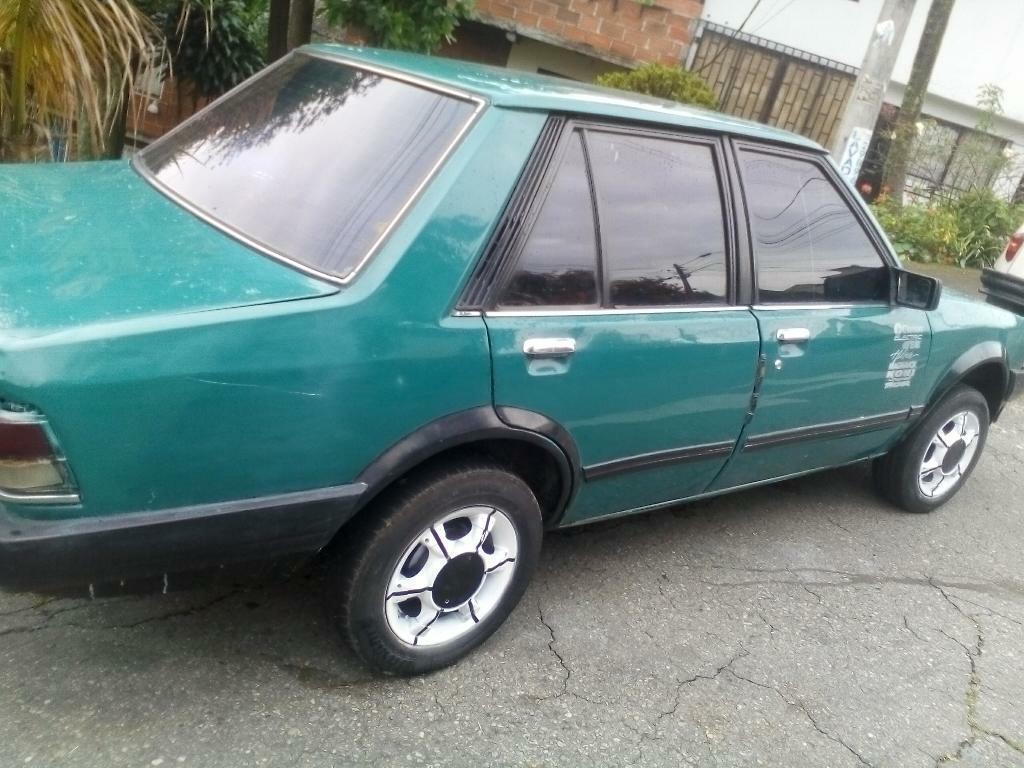 Vendo O Cambio,a Moto Mazda323nb,al Dia